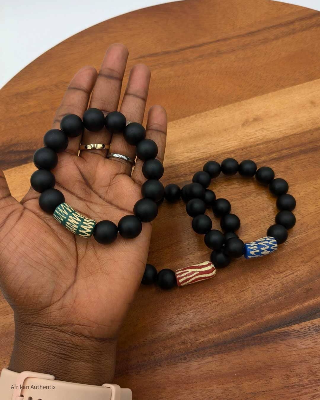 Onyx bracelet with green African bead accent men & women