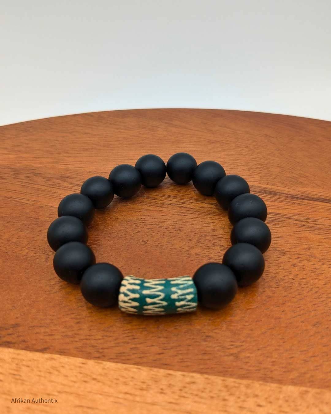 Onyx bracelet with green African bead accent men & women