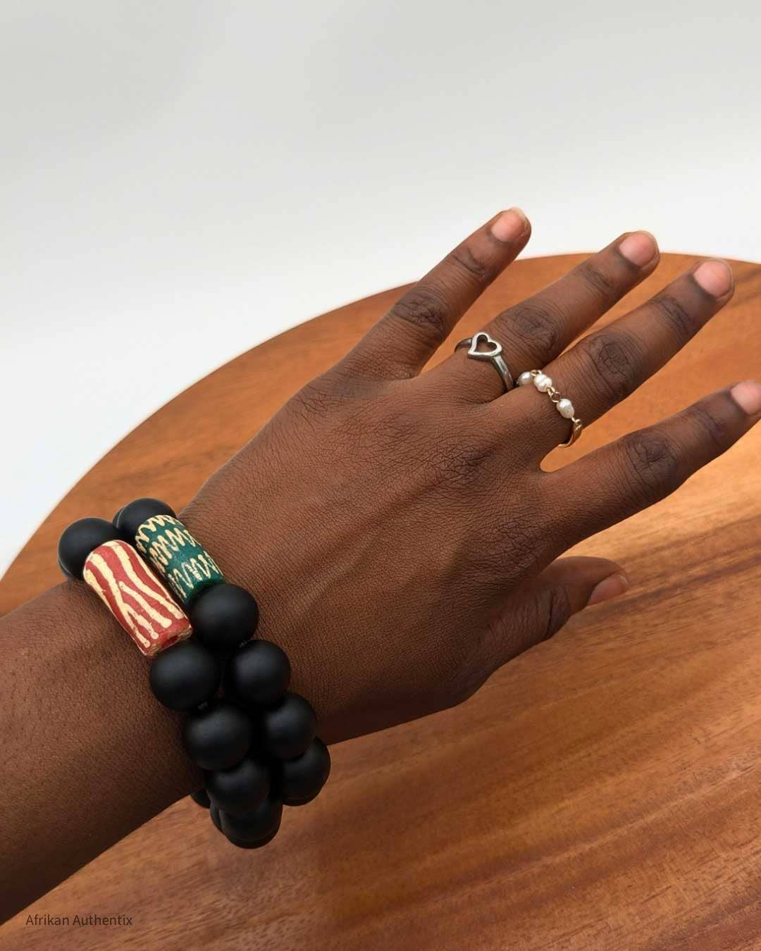 Onyx bracelet with green African bead accent men & women